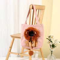Thumbnail for KittyNook Cat Co. Lion Design Soft Cat Carrier Bag on chair beside a vase of white flowers.