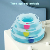 Thumbnail for KittyNook Cat Co. 3-Layer Interactive Cat Toy Tower with balls, pictured on a white surface against a blue wall.