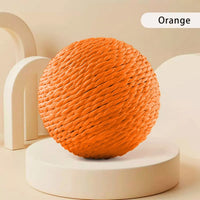 Thumbnail for The KittyNook Cat Co. Premium Sisal Kitten Scratching Ball in orange is displayed on a white round platform.