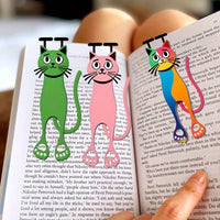 Thumbnail for Three Sleek Flat Cat Acrylic Bookmarks by KittyNook Cat Co. clip onto a book held in someone’s hand.