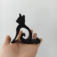 Thumbnail for A hand holding a Cute Cat Phone Stand – Adjustable Mobile & Tablet Holder.