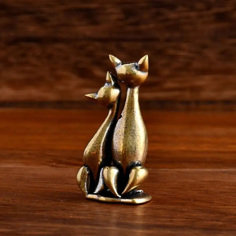 The Intertwined Loving Cats Brass Sculpture by KittyNook Cat Co. is ideal for charming cat couple decor.