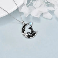 Thumbnail for KittyNook Cat Co. Cute Black Kitty Moon Necklace—perfect cat lover gift with a blue gem on a silver crescent moon.
