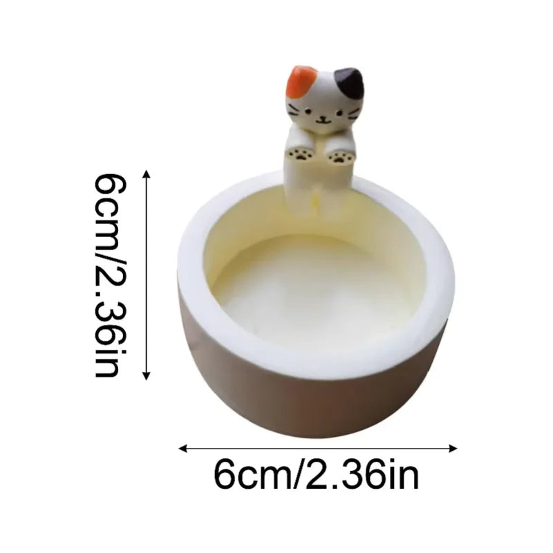 KittyNook Cat Co. Cute Kitten Candle Holder—a small round bowl with a cat figure, ideal for cozy home decor.