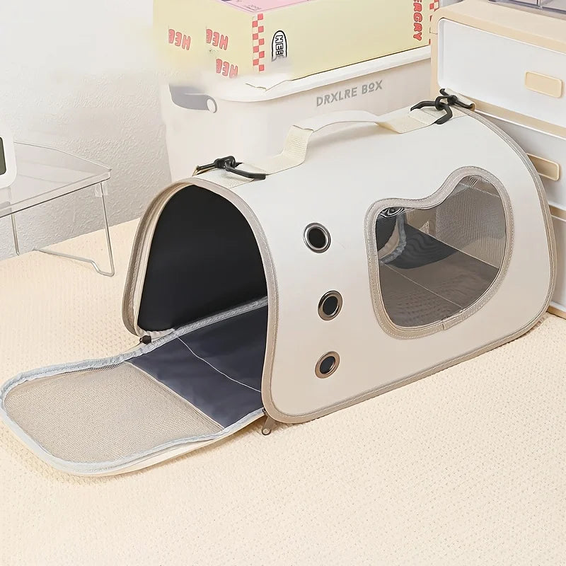 KittyNook Cat Co. Portable Pet Carrier Bag in beige with mesh windows and vents, shown on a light carpeted floor indoors.