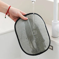 Thumbnail for A hand rinses KittyNook Cat Co. Pet Hair Removal Mitts under running water in a sink.