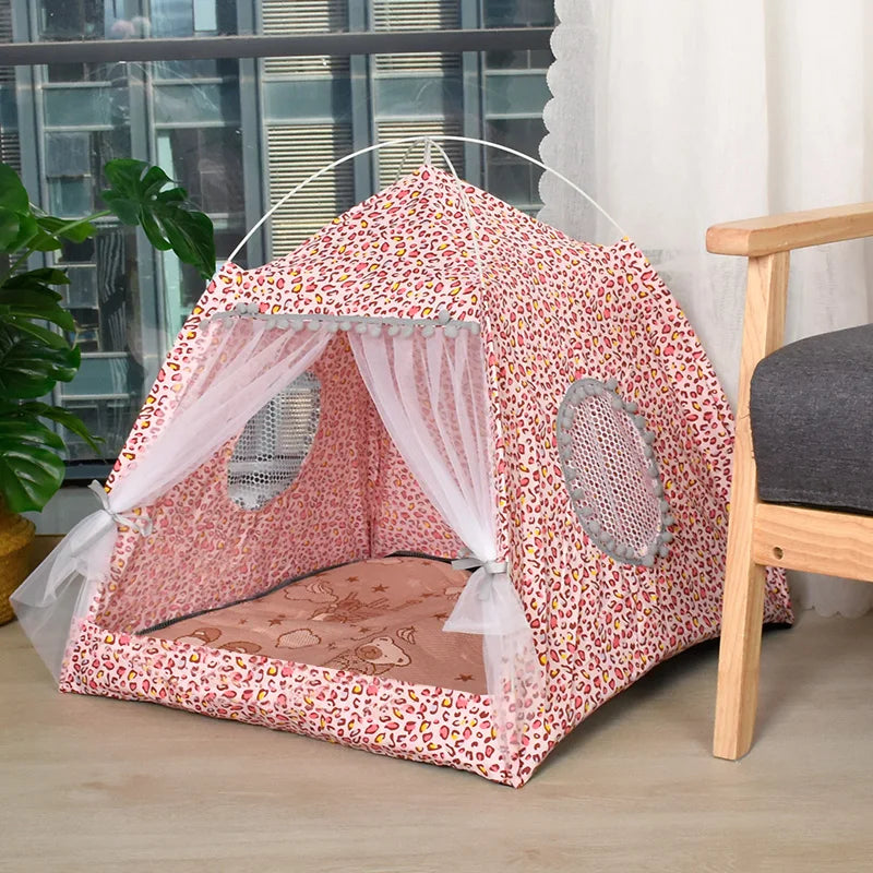 The Serene Petal Semi-Enclosed Indoor Cat Tent by KittyNook Cat Co. is pink with leopard print and mesh windows.