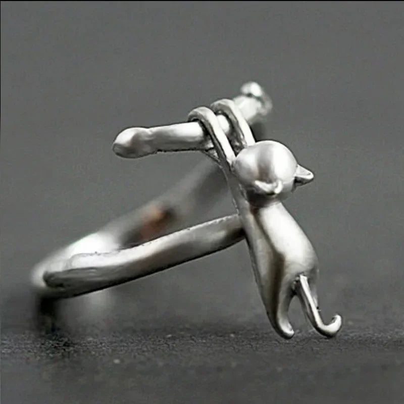 KittyNook Cat Co.'s Sterling Silver Cat Branch Ring features a playful cat and is adjustable for hypoallergenic comfort.