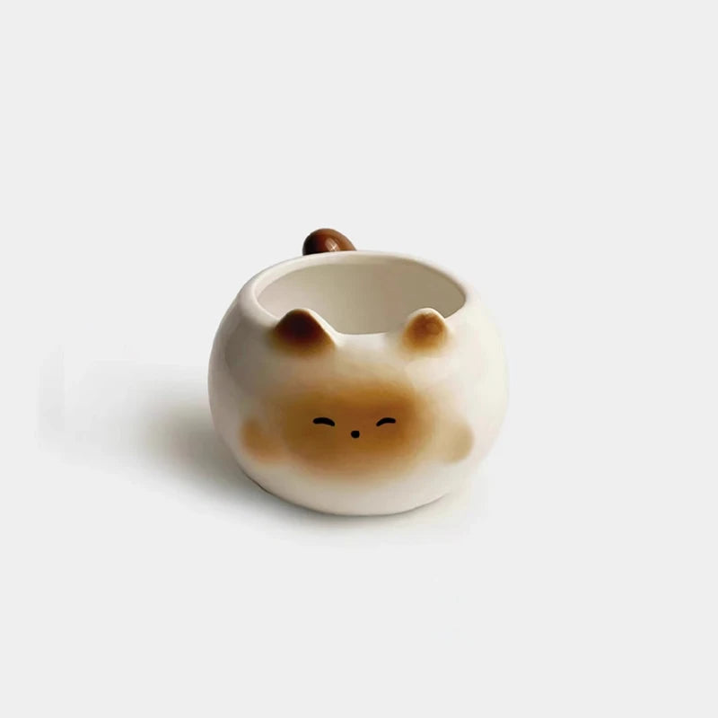 KittyNook Cat Co. Siamese Cat Coffee Cup features a cat face, ears, and tail in light brown and cream—perfect for cat lovers.