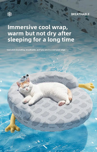 Thumbnail for A white cat relaxes on the KittyNook Cat Co. Ice Silk Cat Nest, shaped like a pool float on a blue water background.