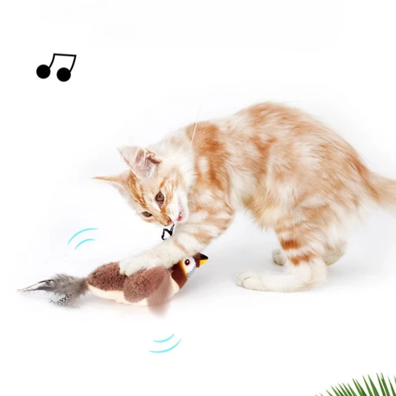 A ginger kitten plays with KittyNook Cat Co.’s Squeaky Plush Cat Toy that moves and makes sound effects.