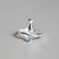 Thumbnail for The Cute Adjustable Silver Cat Ring by KittyNook Cat Co. features a minimal feline design with curled tail and pointed ears.