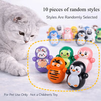 Thumbnail for A cat watches a collection of small, round, animal-shaped Cat Rolling Toy Set – Self-Rolling Interactive Cat Toys.