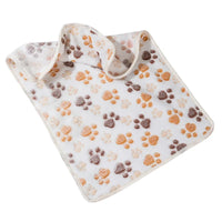 Thumbnail for SnugglePaws Luxe Fleece Pet Blanket by KittyNook Cat Co. features brown, orange, and tan paw prints on white.