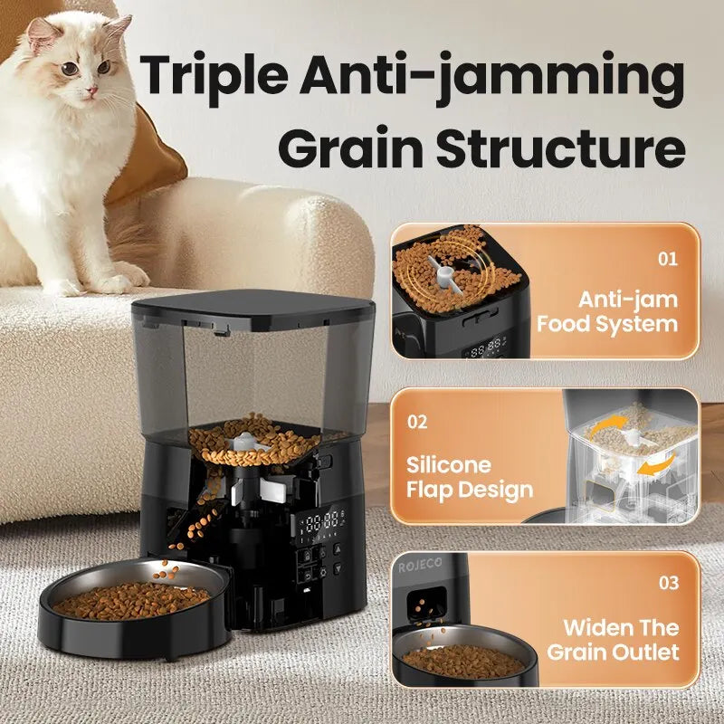 A white cat sits by the ROJECO Smart Dispenser by KittyNook, featuring anti-jam and adjustable portion control.