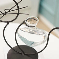 Thumbnail for A glass vase with water sits in a cat-shaped iron frame, a unique Modern Cat Hydroponic Decor by KittyNook Cat Co.