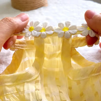 Thumbnail for Hands hold a KittyNook Cat Co. Adorable Cat Summer Dress Cute with yellow checks and floral trim on the neckline.