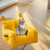 Thumbnail for A fluffy gray cat lounges on a KittyNook Cat Co. Cat Cartoon Sofa Bed, adding charm to the sunlit room.