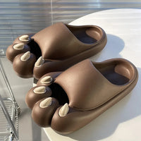 Thumbnail for KittyNook Cat Co.’s Comfy Outdoor Cat Slippers with cute faces and claws provide cozy comfort on a white table.