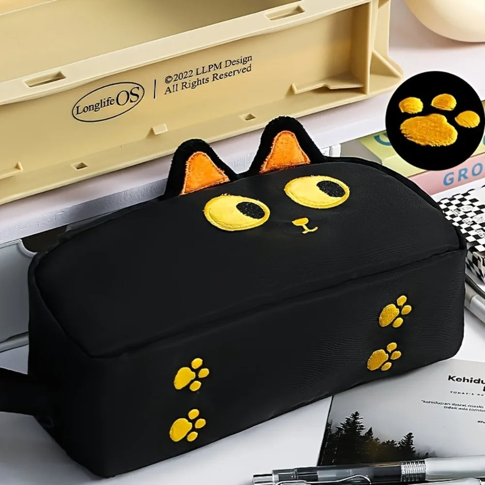KittyNook Cat Co. Adorable 3D Cat Pencil Case—cute yellow-eyed, orange-eared pouch with paw prints for stationery.