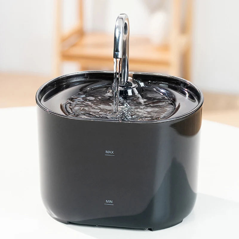 The KittyNook Cat Co. Cat Water Fountain Automatic Filter in black sits on a white surface with max/min markings.