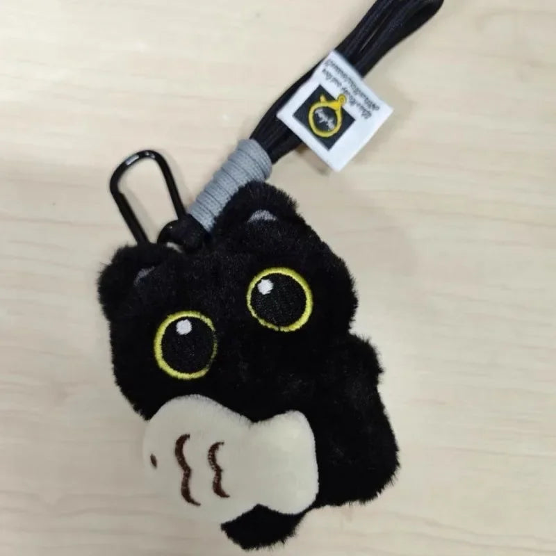 The KittyNook Black Cat Plush Doll Keychain Pendant adds cute charm to bags & keys with its adorable cat design.