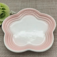 Thumbnail for KittyNook Cat Co. Extra Wide Raised Flower Cat Bowl in pink and white on woven surface with a green faux flower nearby.