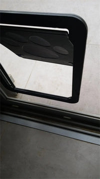Thumbnail for A KittyNook Magnetic Lockable Pet Screen Door is installed in a glass sliding door, partially open to the patio.