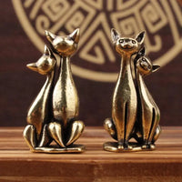 Thumbnail for The Intertwined Loving Cats Brass Sculpture by KittyNook Cat Co. adds artful charm to any patterned backdrop.