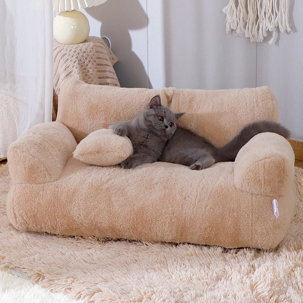 A gray cat lounges on the KittyNook Cat Co. Modern Cat Couch for Happy Paws in a cozy room.