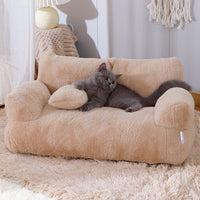 Thumbnail for A gray cat lounges on the KittyNook Cat Co. Modern Cat Couch for Happy Paws in a cozy room.