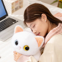 Thumbnail for A woman naps with the KittyNook Cat Co. Cute Big Eyes Kitten Plush Pillow—a cozy cat lover gift for workdays.