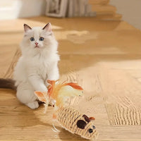 Thumbnail for Blue-eyed white kitten plays on wood floor with KittyNook Cat Co. Sisal Fake Mouse Interactive Self-Play Toy.