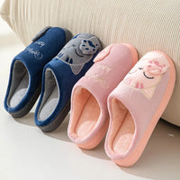 Thumbnail for Stay cozy at home in KittyNook Cat Co.'s Happy Pawprints Lucky Cat Slippers—two blue, two pink, soft and cushioned.