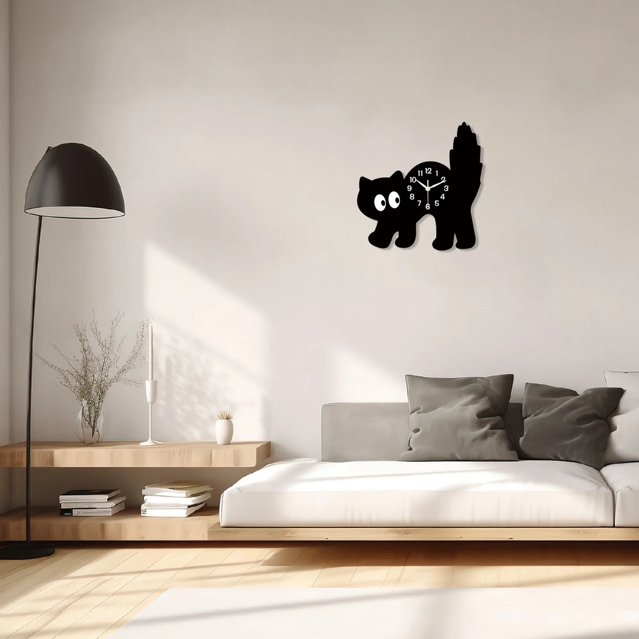 Modern living room with a KittyNook Cat Co. Crystal Porcelain Black Cat Wall Clock, grey couch, and minimalist decor.