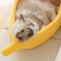 Thumbnail for A fluffy cat lounges in the KittyNook Cat Co. Cute Funny Banana Shape Cat Bed, enjoying cozy orthopedic support.