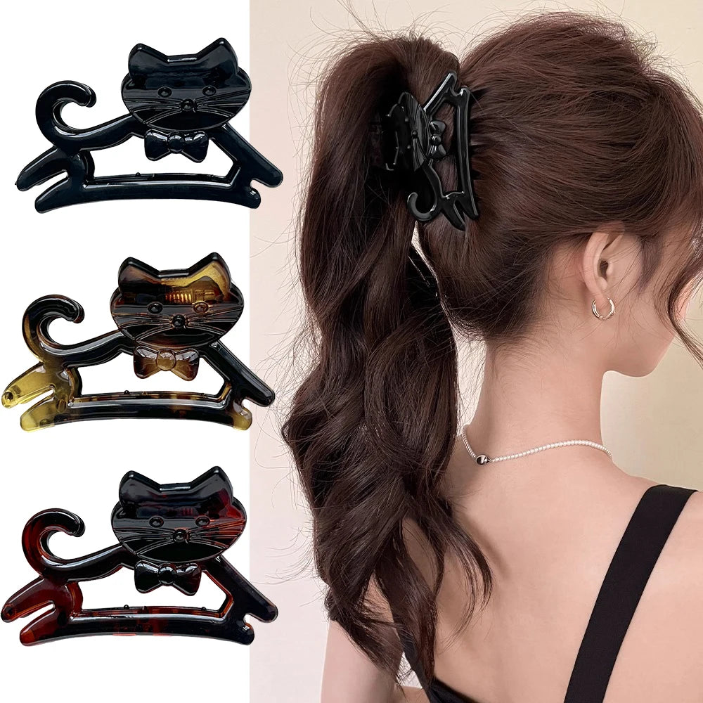Three Cute Cat Hair Claws by KittyNook Cat Co. in playful colors, plus a woman styling one in her wavy ponytail.
