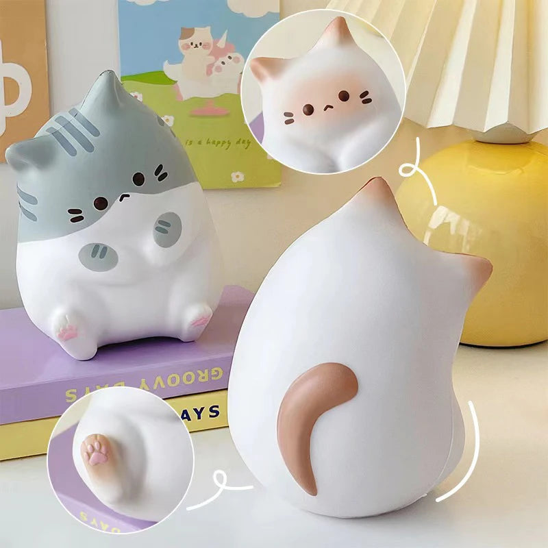 KittyNook Cat Co. Cat Squeeze Balls: Two cute cats—front & back view—with face and paw close-ups for stress relief.