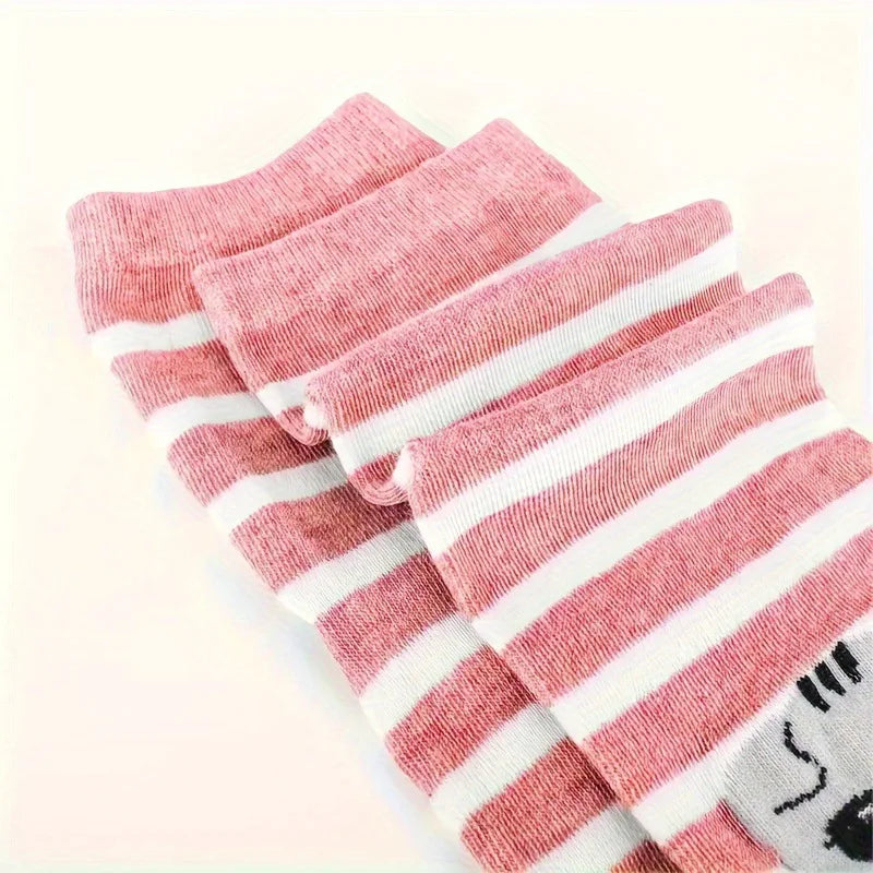The Cute Meow & Snuggle Women’s Sock Set by KittyNook Cat Co., in pink and white stripes, neatly folded.