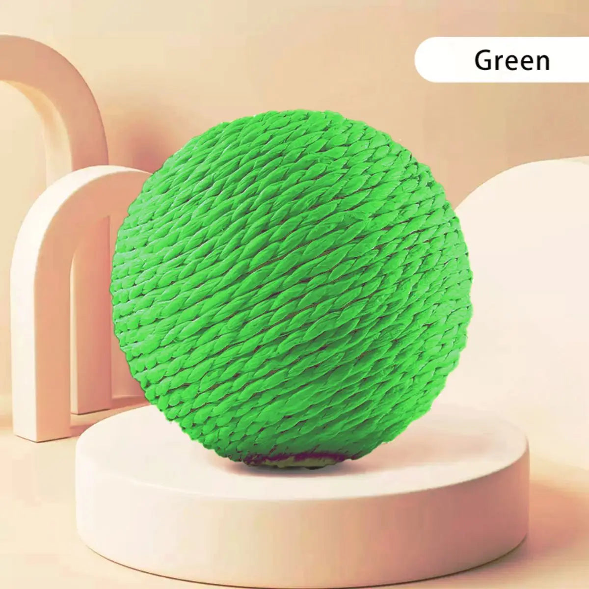 The Premium Sisal Kitten Scratching Ball by KittyNook Cat Co. rests on a round white platform with a beige backdrop.