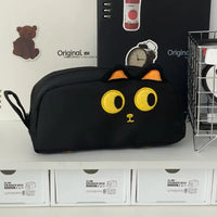 Thumbnail for The KittyNook Cat Co. Adorable 3D Cat Pencil Case with yellow accents sits on a shelf with cute stationery.