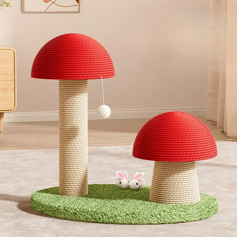 Two KittyNook Cat Co. Decorative Cat Climbing Posts with red tops & toy mouse on green carpet in a cozy indoor room.