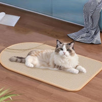 Thumbnail for A fluffy blue-eyed cat rests on a KittyNook Cat Co. Durable Sisal Cat Scratch Pad beside a black-and-white cloth.