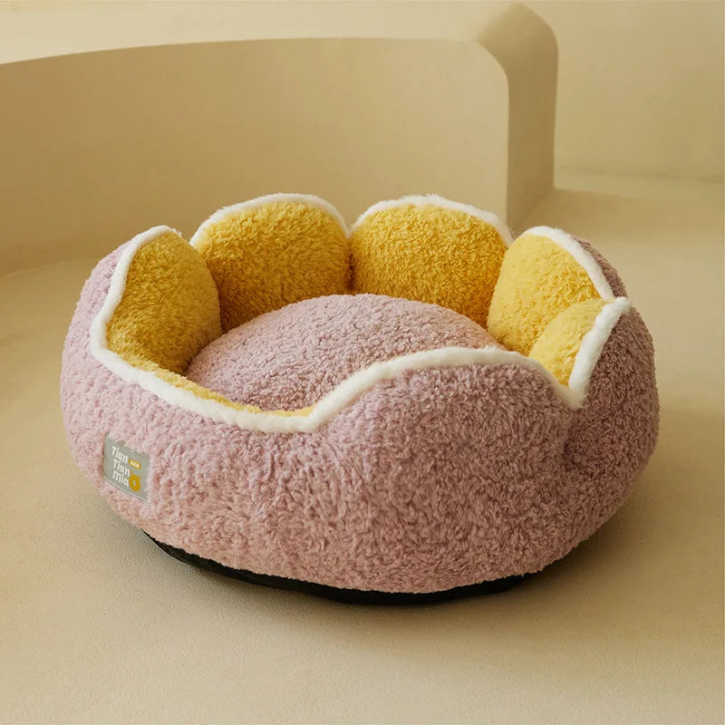 The Warm & Soft Cat Sleeping Pod by KittyNook Cat Co. features yellow and pink flower sections on a beige surface.