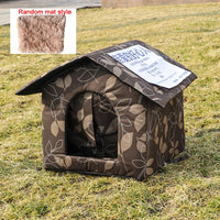 Thumbnail for KittyNook Cat Co.'s PurrFort Waterproof Outdoor Cat Cave with leaf print sits on grass; a furry mat is in one corner.