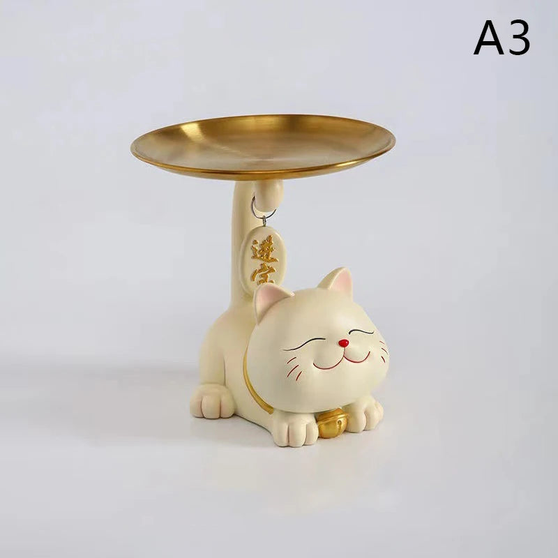 The Chic Cat Metal Key Tray by KittyNook Cat Co. features a smiling white cat balancing a gold plate labeled "A3.