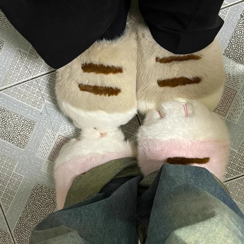 Two people in KittyNook Cat Co. Adorable Kitty Claw Slippers stand face to face on patterned tile flooring.