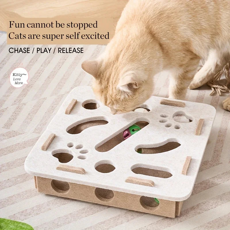 A cat enjoys the KittyNook Cat Co. Interactive Felt Cat Maze Puzzle Box. "Fun cannot be stopped. Cats love it!.