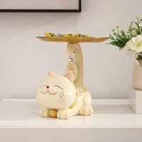 Thumbnail for The Chic Cat Metal Key Tray by KittyNook Cat Co. holds keys and candy beside a flower vase on a white table.