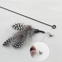 Thumbnail for KittyNook Cat Co. Eco-Friendly Wood & Feather Cat Teaser features a close-up of the detailed silver bell attachment.